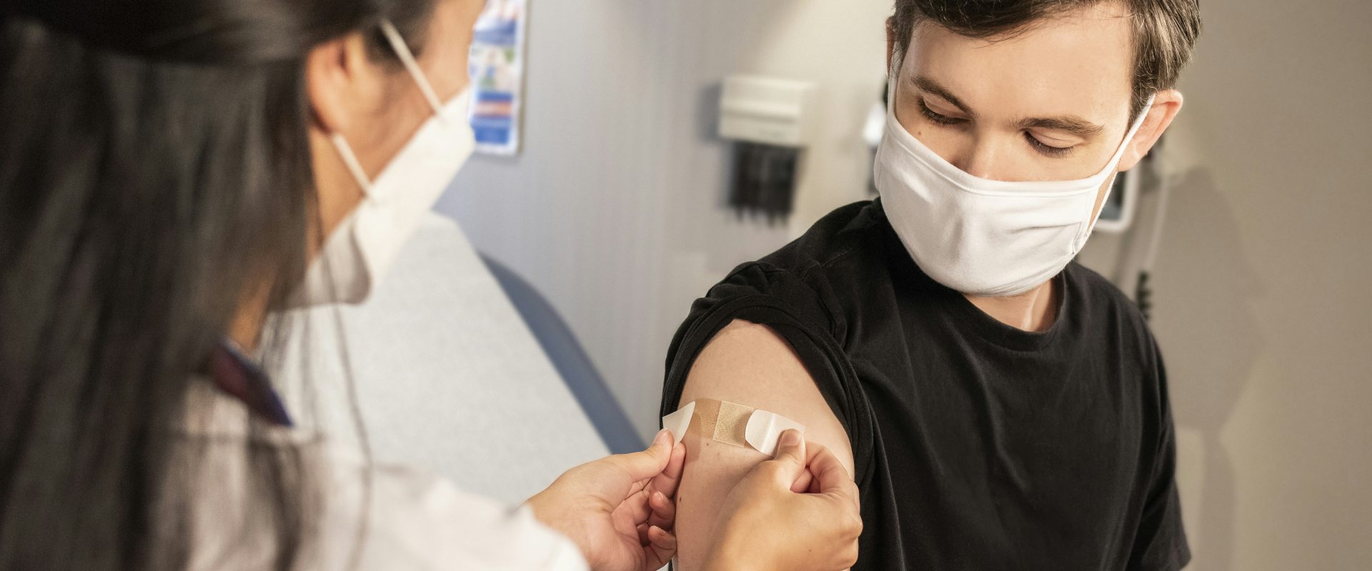 Stock image of a patient receiving a vaccination